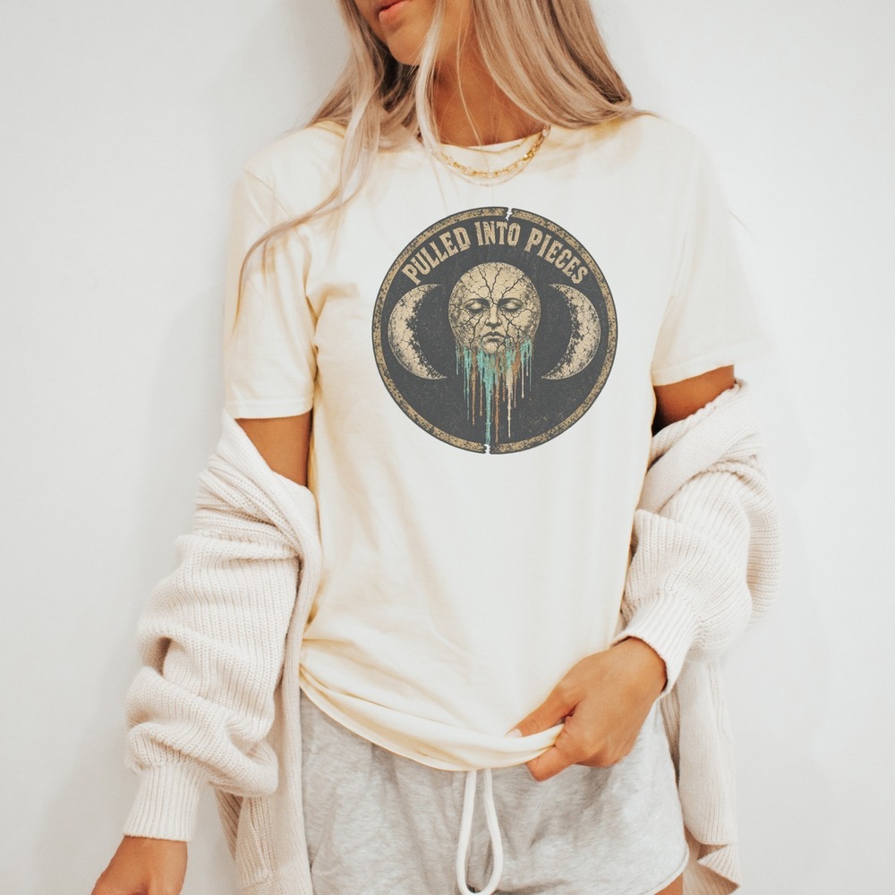 Pulled Into Pieces Crumbling Moon Face Badge Tee